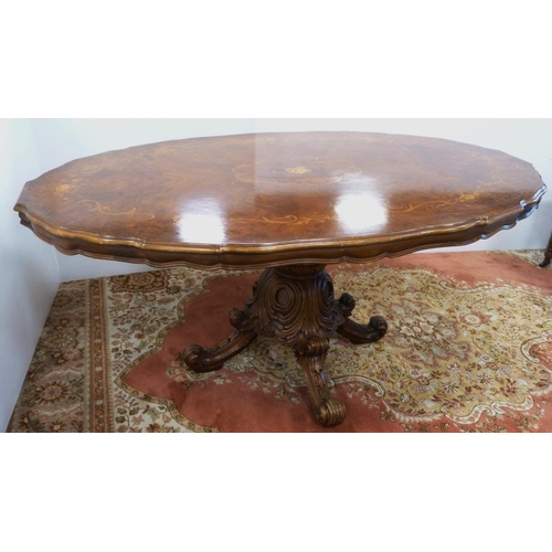 126 - Italian Sorrento-style walnut dining table with scroll inlay to the shaped top, on turned and carved... 