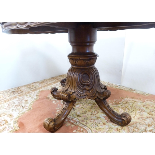 126 - Italian Sorrento-style walnut dining table with scroll inlay to the shaped top, on turned and carved... 