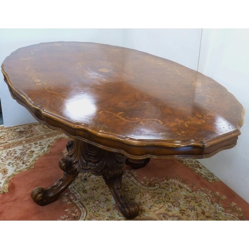 126 - Italian Sorrento-style walnut dining table with scroll inlay to the shaped top, on turned and carved... 