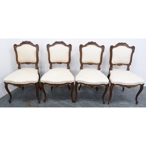 128 - Set of four French-style parlour chairs, upholstered in later cream floral stuff-over fabric, on sab... 