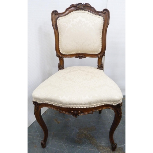 128 - Set of four French-style parlour chairs, upholstered in later cream floral stuff-over fabric, on sab... 