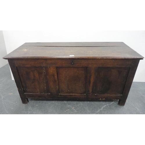 132 - 19th century oak coffer with hinged top enclosing a pine candle box, three-panel front, iron lock, o... 