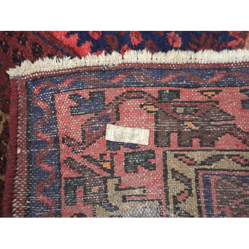 133 - North West Persian hand-knotted rug with geometric medallion to the centre within further geometric ... 