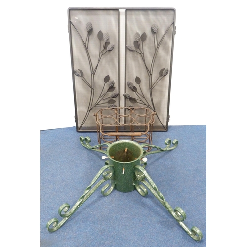 29 - Metal six-aperture bottle rack with swing handle, painted Christmas tree stand and a mesh folding th... 