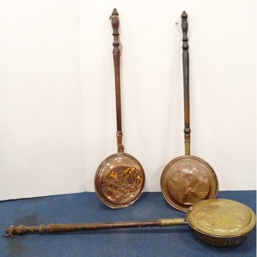 30 - Three copper and brass bed warming pans, all with turned wooden handles.