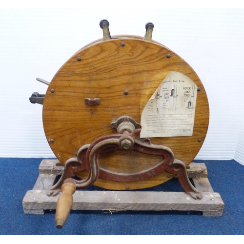 35 - Antique oak and cast iron knife sharpener on a fixed stand.