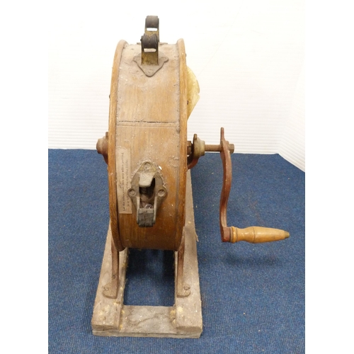 35 - Antique oak and cast iron knife sharpener on a fixed stand.