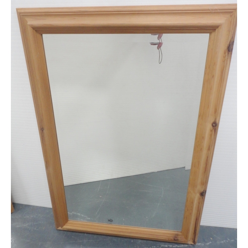 64 - Two modern pine-framed wall mirrors, the largest 96cm x 69cm.  (2)