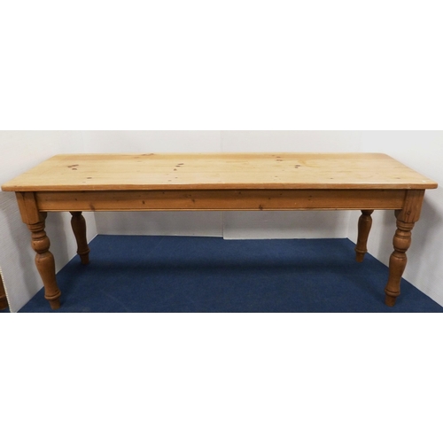 98 - Pine refectory-type dining table on turned supports, 77cm high, 214cm long and 66cm wide.