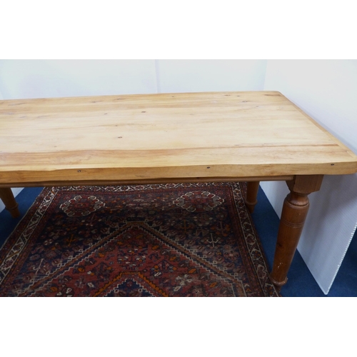 99 - Pine refectory-type dining table on turned supports, 76cm high, 182cm long and 83cm wide.