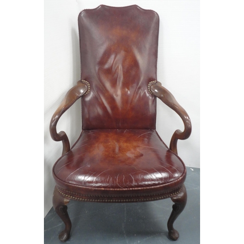 140 - 'The Hickory Chair' in the form of a library chair, upholstered in studded reddish brown leather, do... 