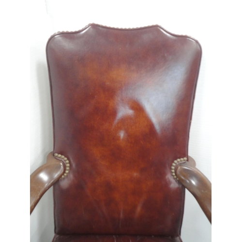 140 - 'The Hickory Chair' in the form of a library chair, upholstered in studded reddish brown leather, do... 