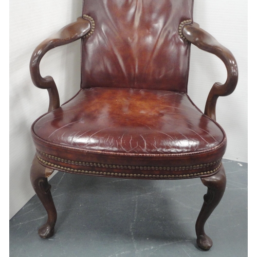 140 - 'The Hickory Chair' in the form of a library chair, upholstered in studded reddish brown leather, do... 