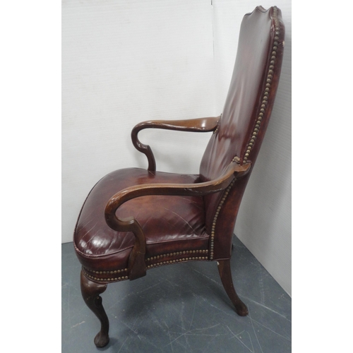 140 - 'The Hickory Chair' in the form of a library chair, upholstered in studded reddish brown leather, do... 