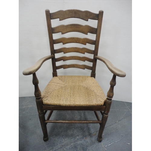 142 - Elm farmhouse ladderback elbow chair with woven detachable rush seat, c. early 20th century, 104cm h... 