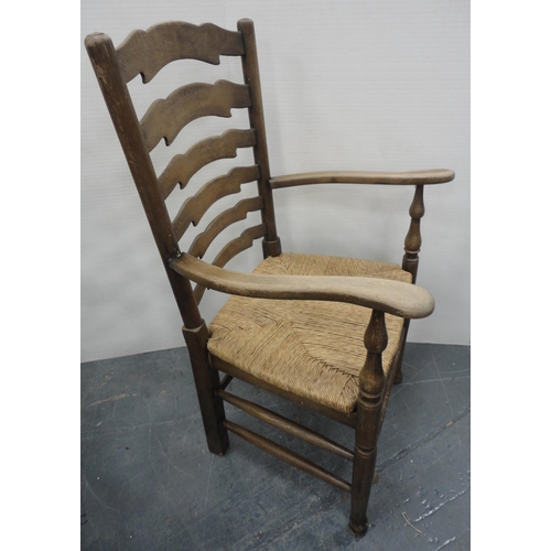 142 - Elm farmhouse ladderback elbow chair with woven detachable rush seat, c. early 20th century, 104cm h... 