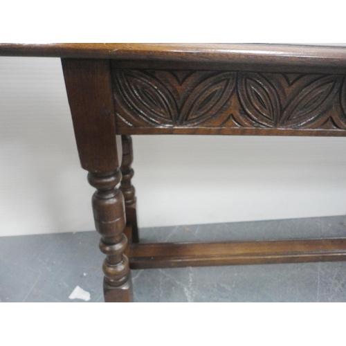 145 - Victorian-style oak bench with plank top, incised decoration to the frieze, on turned columns and bl... 