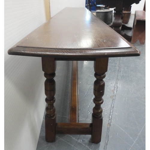 145 - Victorian-style oak bench with plank top, incised decoration to the frieze, on turned columns and bl... 