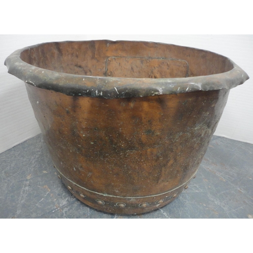 147 - Antique copper planter, the lower part riveted, 36cm high and 55cm diameter.