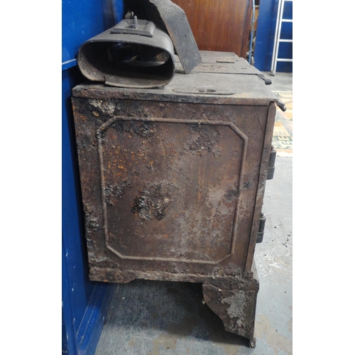 151 - 'The Belle Portable' cast iron range, with lift-off compartments to the top section, with flue, abov... 