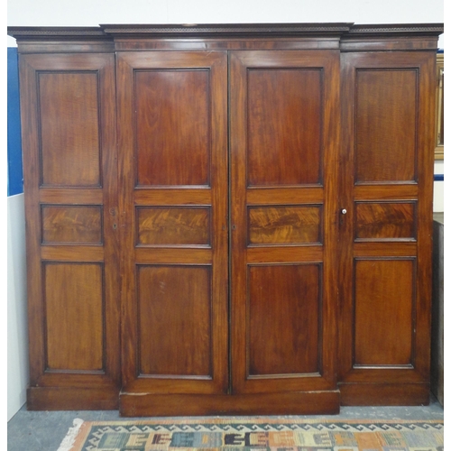 152 - Victorian mahogany four-door breakfront wardrobe with Greek key-type cornice above four panelled doo... 