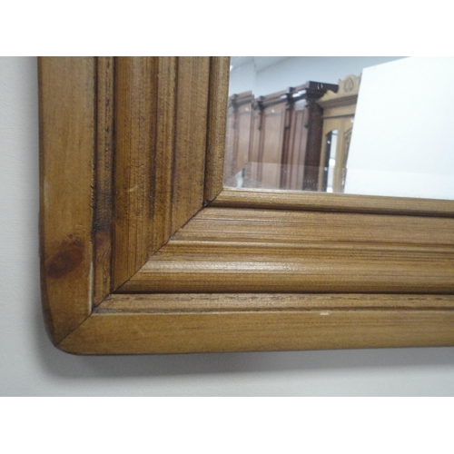 154 - Pine-framed wall mirror, 68cm x 93cm.