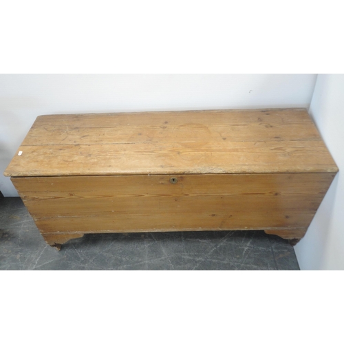 160 - Victorian pine coffer with a hinged top enclosing a candle box, on shaped feet, 67cm high, 132cm wid... 