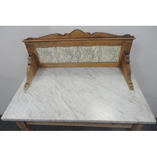 167 - Pine wash stand with marble top and tiled splash-back, 103cm high, 77cm wide and 46cm deep.