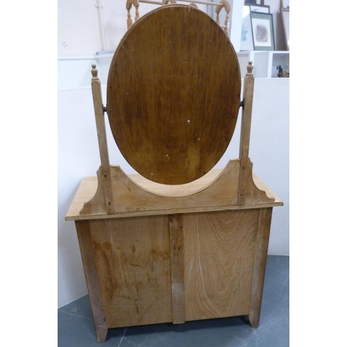 172 - Pine dressing chest with oval swing mirror above two short and two long drawers, 148cm high, 94cm wi... 