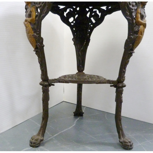 174 - Cast iron painted pub table, with circular wooden top, the supports decorated with Britannia within ... 