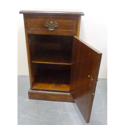 176 - Early 20th century walnut inlaid bedside locker with a short drawer above a cupboard door enclosing ... 