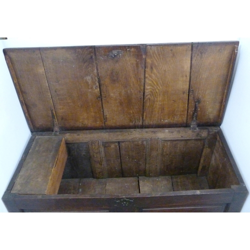 181 - Oak coffer, c. late 18th/early 19th century, with hinged top enclosing a later fitted pine candle bo... 