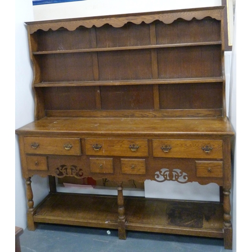 184 - Late 19th/early 20th century oak dresser with shaped apron to the top above two open shelves, the ba... 