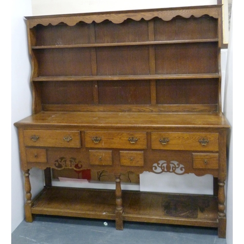 184 - Late 19th/early 20th century oak dresser with shaped apron to the top above two open shelves, the ba... 