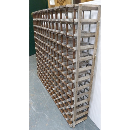 190 - Pine and galvanised bottle rack with 168 apertures, 120cm high, 140cm wide and 26cm deep.