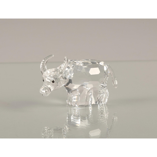 14 - Swarovski Crystal buffalo and an Alsatian, both boxed