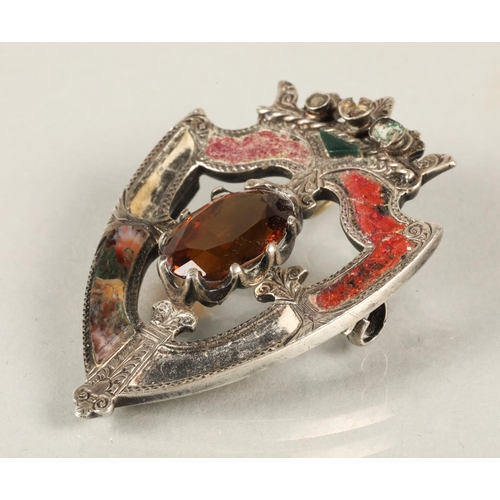 82 - Scottish silver crest shaped brooch set with agate and an orange gem, a silver fob medallion Birming... 