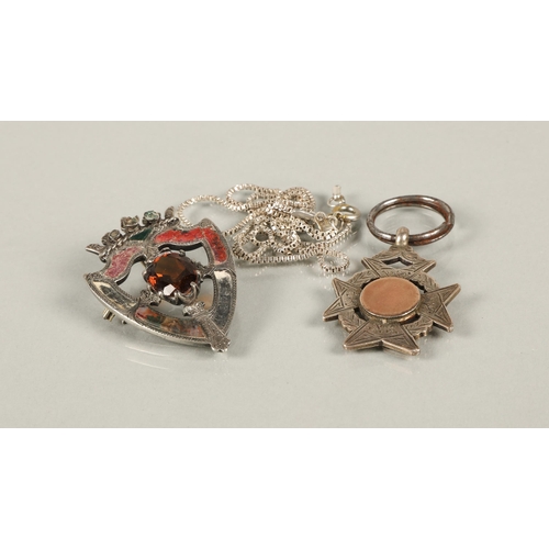 82 - Scottish silver crest shaped brooch set with agate and an orange gem, a silver fob medallion Birming... 