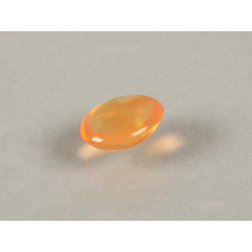 85 - Two loose gemstones, a cabochon 9mm across likely fire opal, and a faceted pink gem 4.5mm across lik... 