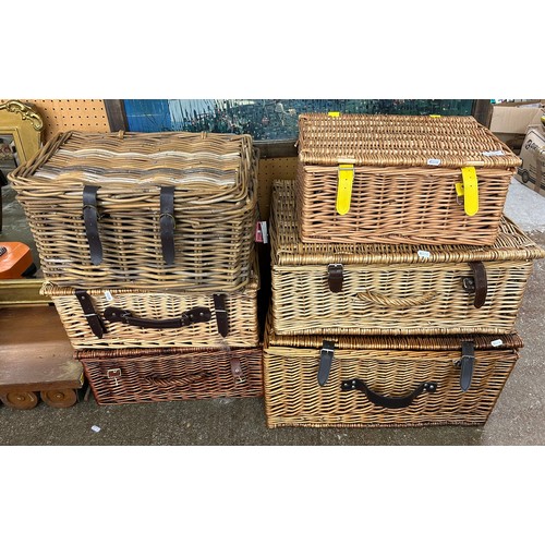 663 - Six assorted wicker baskets (some including silver plated cutlery).