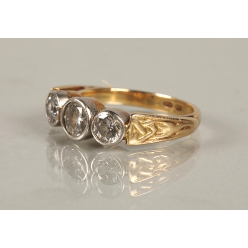 103 - Yellow metal ring marked indistinctly 'MTM' set with three diamonds, approximately 0.65 carat centre... 