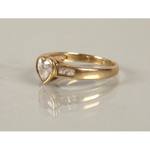 104 - A 9K gold ring set with CZ in a heart design ring size N, and another 14K set with baguette cut whit... 