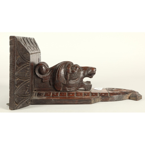 273 - Carved oak wall sconce supported on an animal.