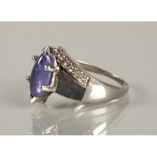 90 - Three silver rings set with purple gemstones likely amethyst/tanzanite, and a PtB bangle in matching... 