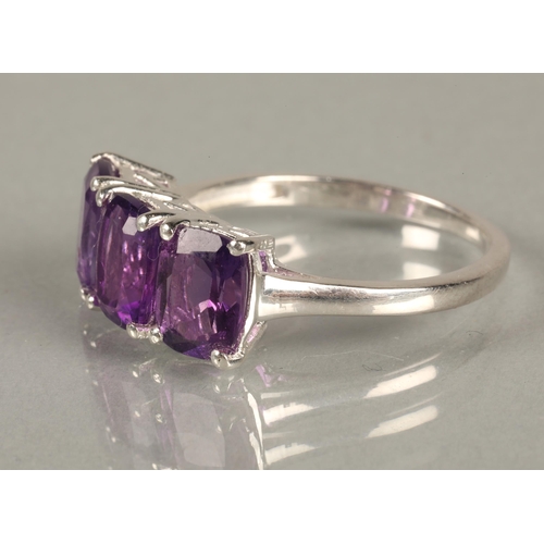 90 - Three silver rings set with purple gemstones likely amethyst/tanzanite, and a PtB bangle in matching... 