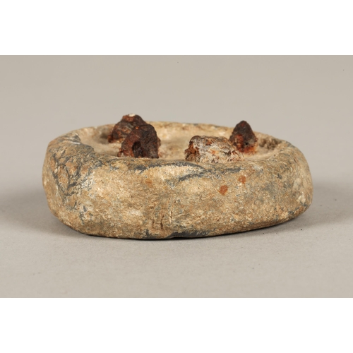 205 - Lead weight inset with metal pins, accompanying note reads 'Roman weight discovered at 