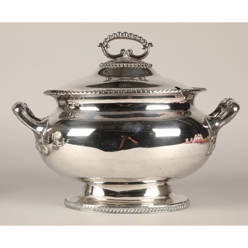 246 - An EPNS twin handled soup tureen and cover 38cm, also a pair of three branch candelabra