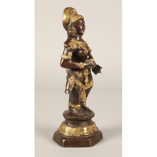 259 - Bronzed figure of a Tibetan goddess. 30cm