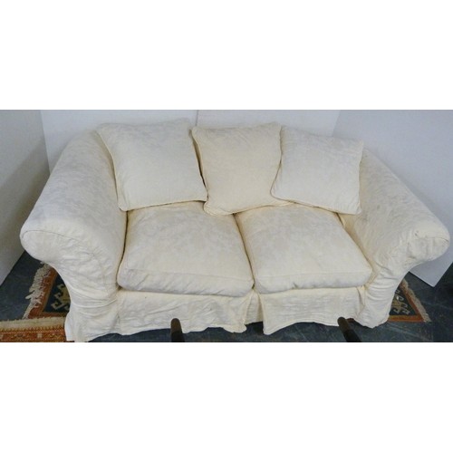 194 - Suite of three two-seater cream upholstered sofas.