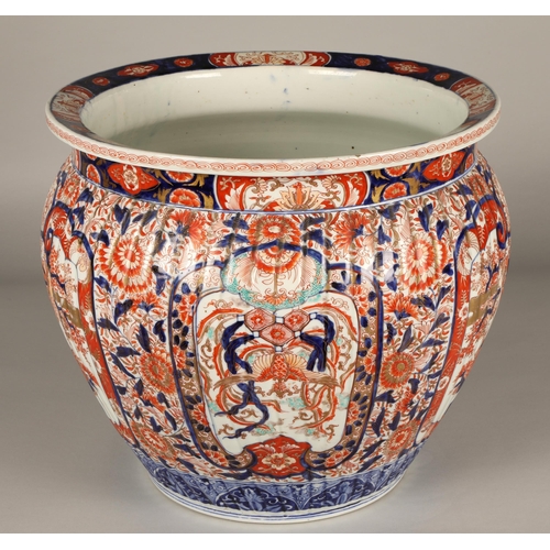 31 - Japanese Imari pattern jardinière of ribbed form, 37cm high.